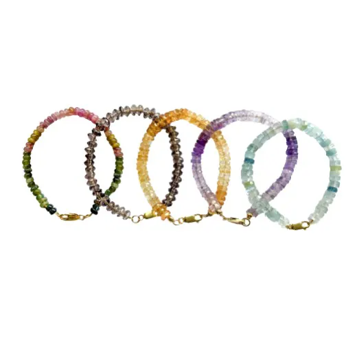 Five fine gemstone bead bracelets side by side, in tourmaline, smoky quartz, citrine, amethyst and aquamarine
